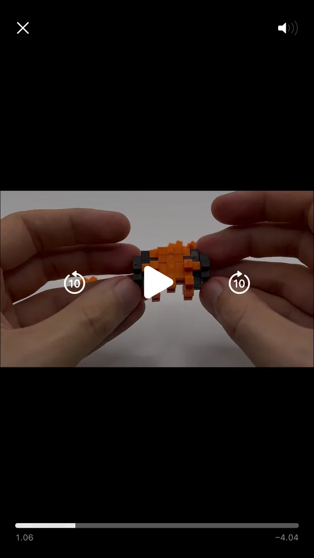 Plus-Plus App video build guide showing hands assembling blocks